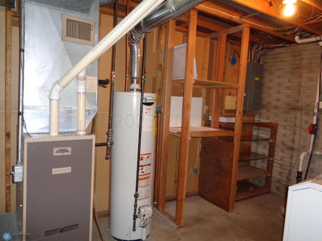 utilities featuring gas water heater, visible vents, electric panel, and heating unit