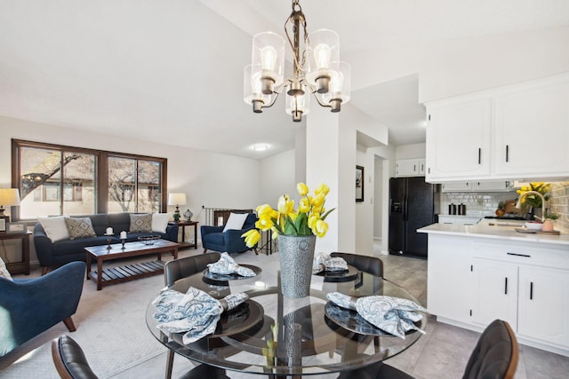 dining area featuring an inviting chandelier