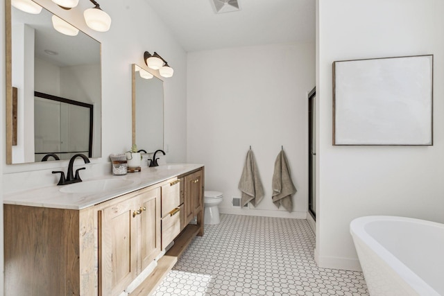 full bath with a soaking tub, visible vents, a sink, and double vanity