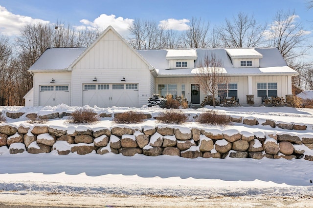 view of front of home with an attached garage and board and batten siding