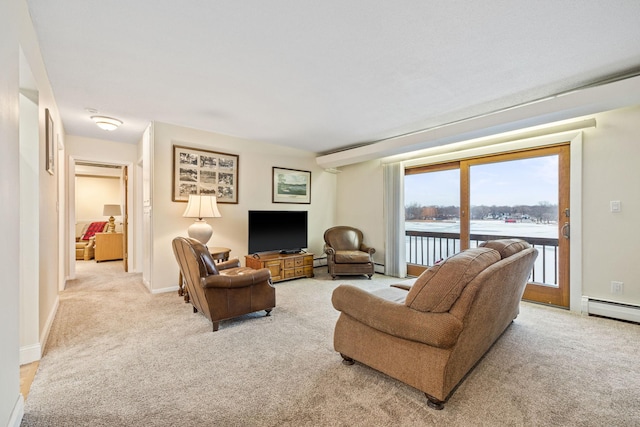 living room with baseboard heating, light carpet, and baseboards