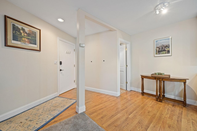 entrance foyer with light wood-style floors, recessed lighting, and baseboards