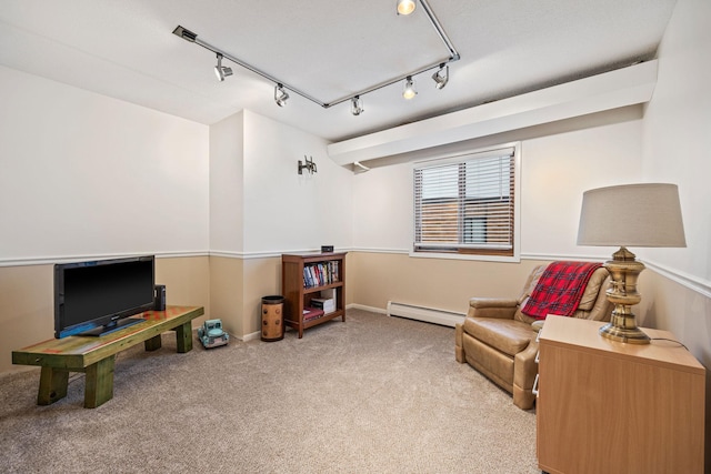 sitting room with carpet floors and a baseboard radiator