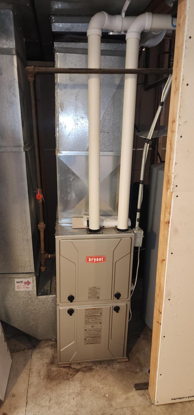 utility room with water heater