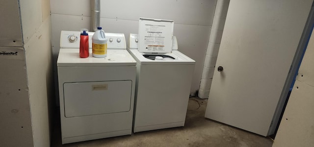 laundry room featuring washing machine and dryer and laundry area