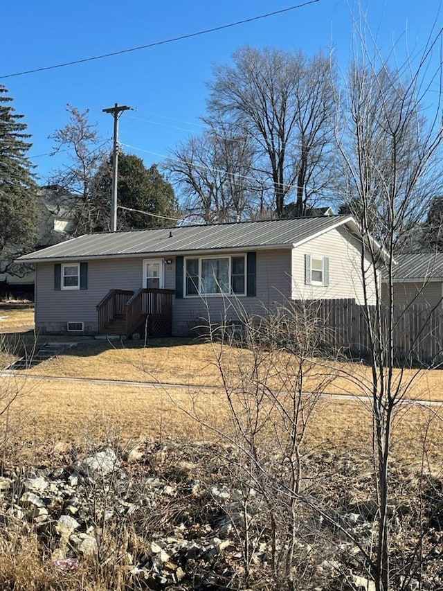 view of front of home featuring metal roof