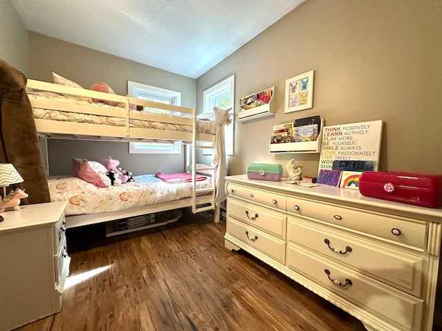 bedroom with dark wood-style floors