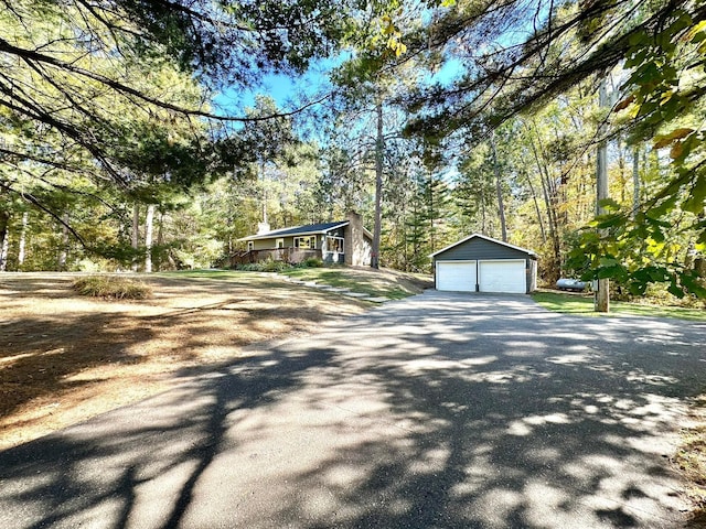 view of front facade with a garage and an outdoor structure