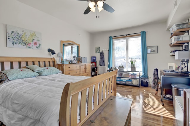 bedroom with ceiling fan and light wood-style flooring