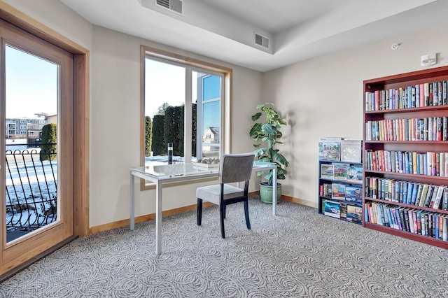 office featuring baseboards and visible vents