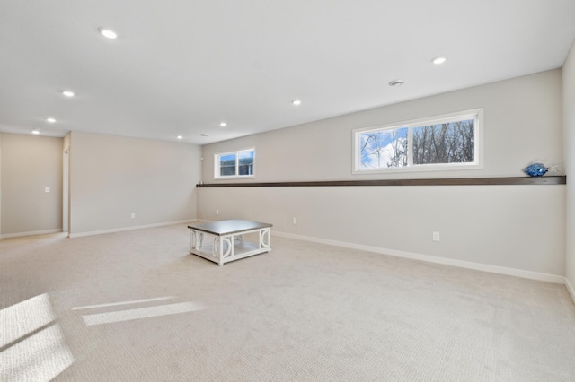 interior space featuring baseboards, light carpet, and recessed lighting