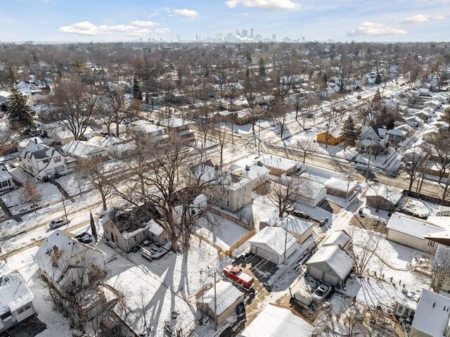 snowy aerial view with a residential view