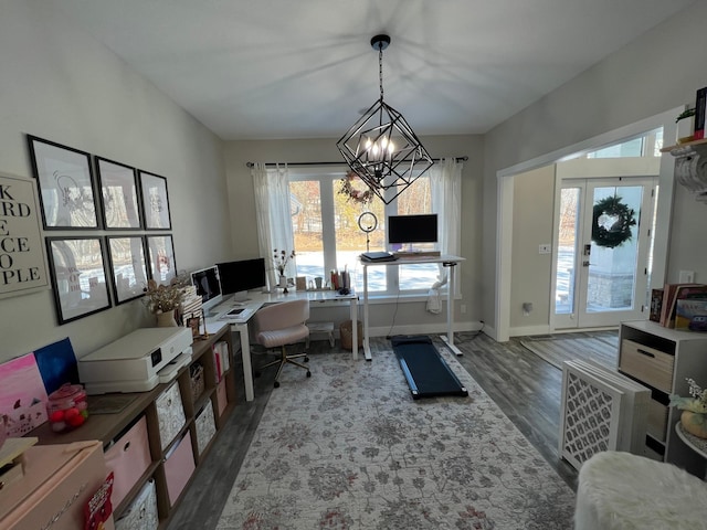 home office with dark wood-style flooring, an inviting chandelier, and baseboards