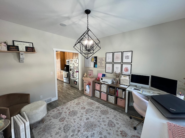 office with dark wood-style floors, visible vents, a notable chandelier, and baseboards