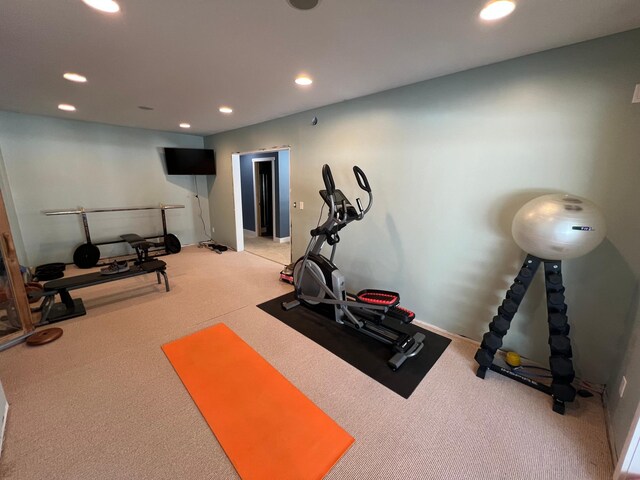 workout area featuring carpet and recessed lighting