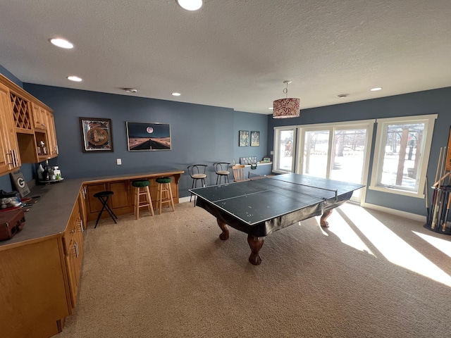 playroom featuring recessed lighting, a textured ceiling, and light colored carpet