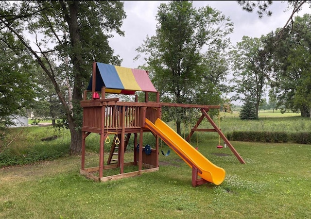 view of play area featuring a lawn