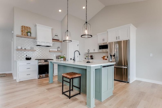 kitchen featuring open shelves, appliances with stainless steel finishes, light countertops, and white cabinets