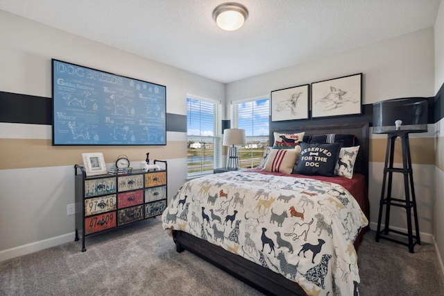 carpeted bedroom with a textured ceiling and baseboards