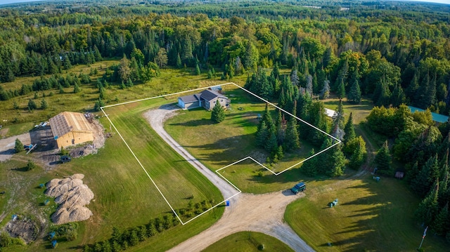 aerial view featuring a wooded view