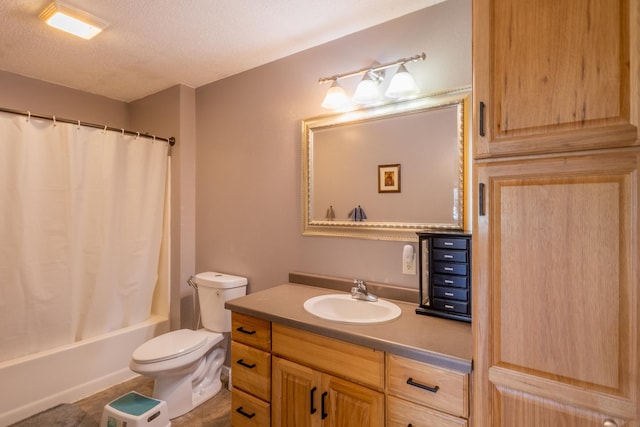 full bathroom with toilet, shower / bath combo with shower curtain, a textured ceiling, and vanity