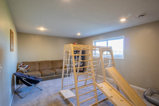 carpeted living room featuring recessed lighting and baseboards