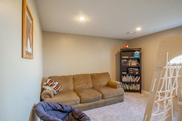 carpeted living room with recessed lighting and baseboards