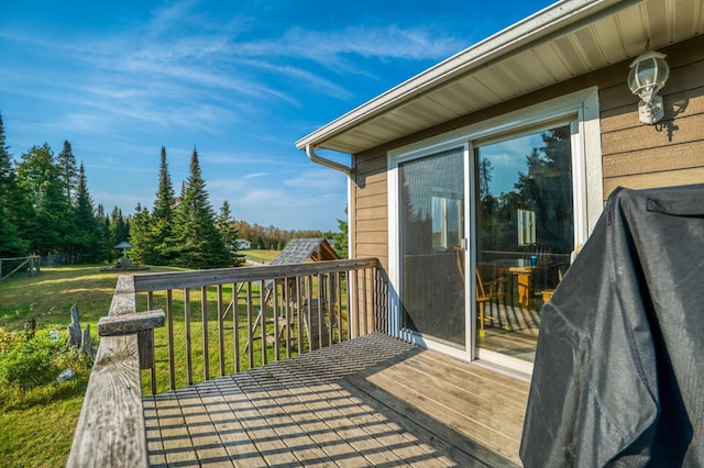 wooden deck with a yard