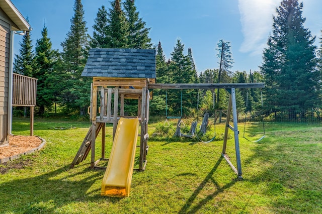 view of jungle gym featuring a lawn