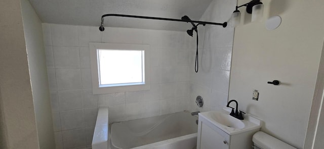 bathroom with toilet, vanity, and shower / tub combination