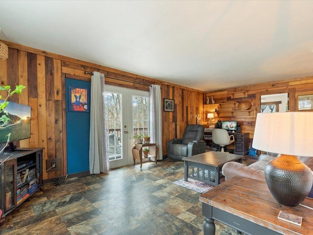 11288 Leewood Ln, East Gull Lake, MN 56401 - living area with wood walls, french doors, and stone finish flooring