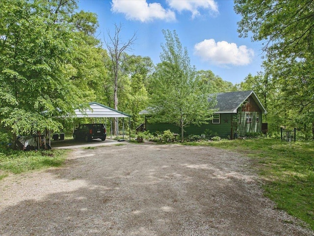 11288 Leewood Ln, East Gull Lake, MN 56401 - view of yard featuring a detached carport and driveway