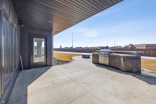 view of patio / terrace with area for grilling and a fenced backyard