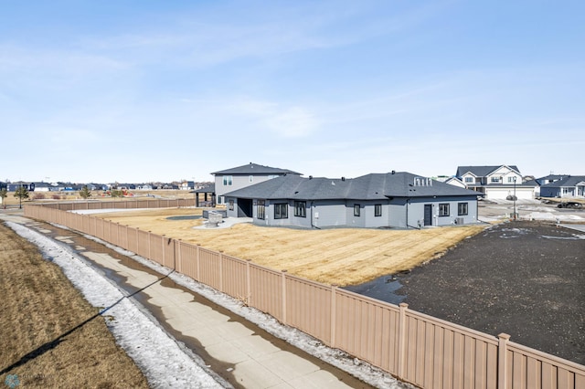 exterior space featuring a fenced backyard