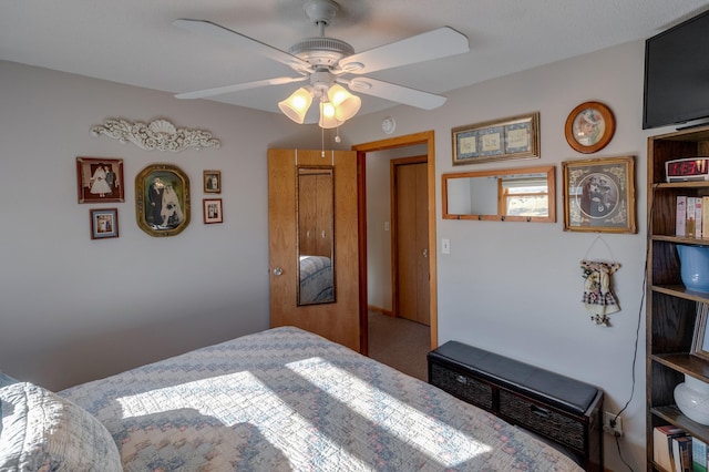 carpeted bedroom with a ceiling fan