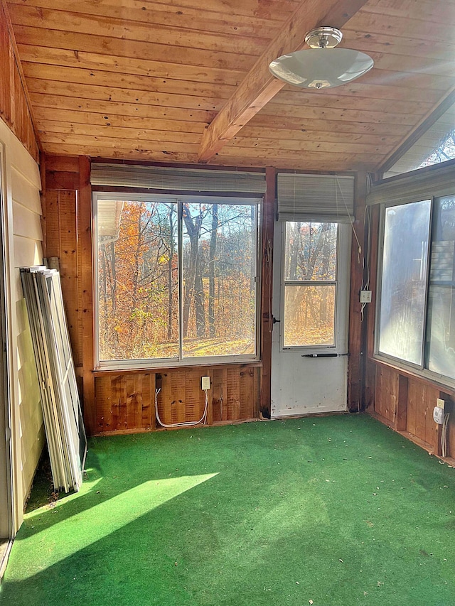 unfurnished sunroom featuring a wealth of natural light, wooden ceiling, and vaulted ceiling