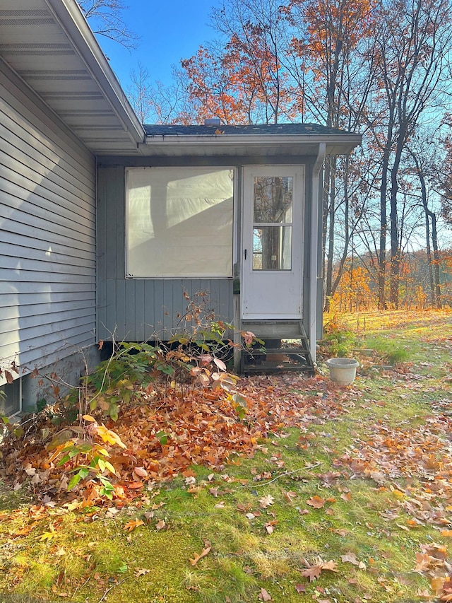 view of side of home featuring entry steps