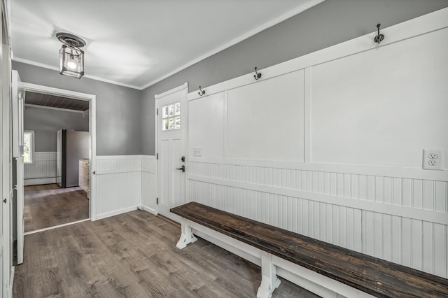 mudroom featuring a baseboard heating unit, ornamental molding, wood finished floors, and wainscoting