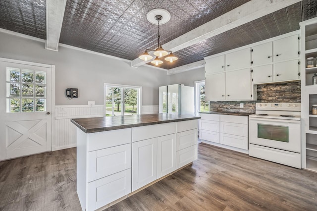 kitchen featuring an ornate ceiling, white cabinets, white electric range, and plenty of natural light