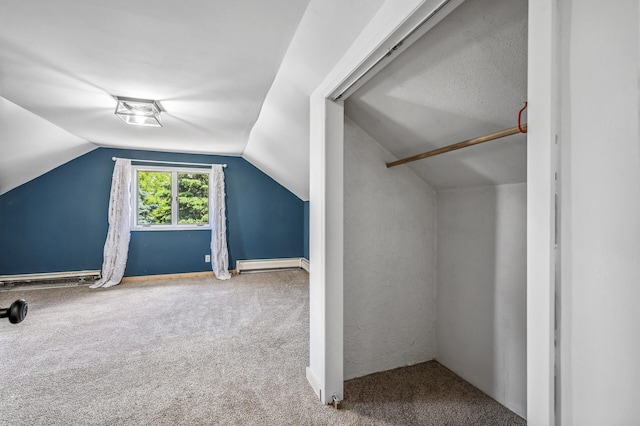 bonus room featuring carpet, vaulted ceiling, and baseboard heating