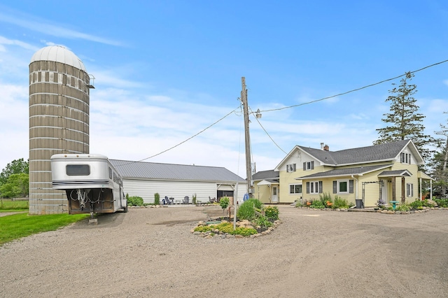 exterior space featuring dirt driveway