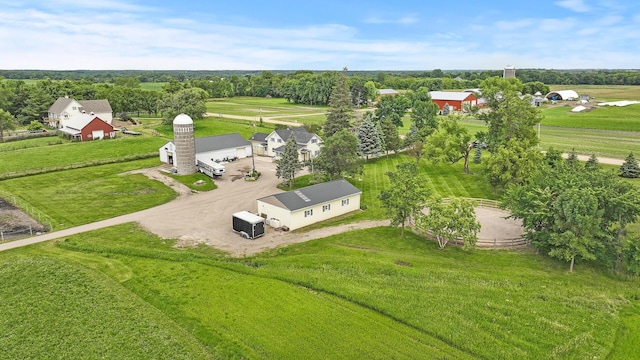 birds eye view of property with a rural view