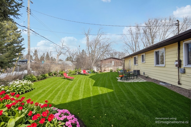 view of yard featuring fence and a patio