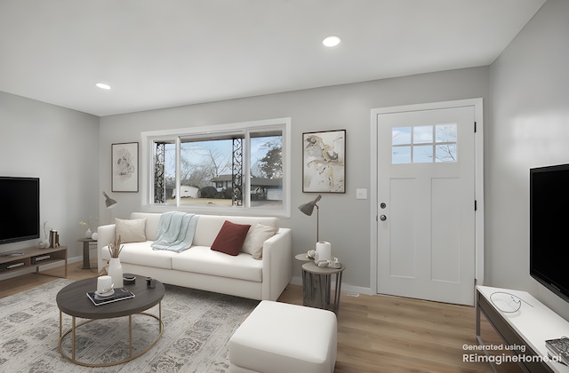 living area with baseboards, light wood-type flooring, a wealth of natural light, and recessed lighting