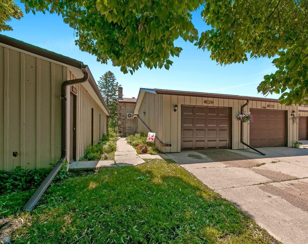 garage featuring concrete driveway