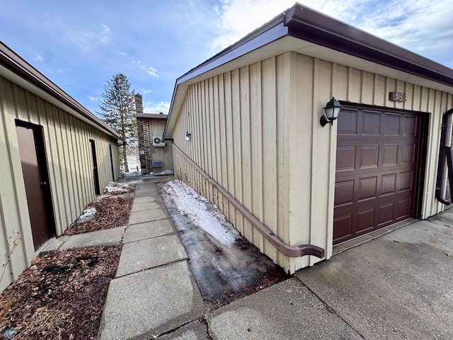 view of side of home featuring a garage