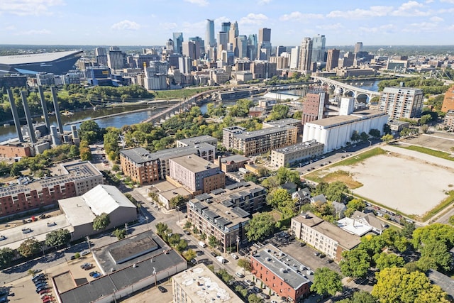 bird's eye view featuring a water view and a city view