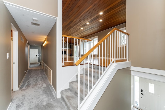 1509 Woodland Dr SW, Rochester, MN 55902 - staircase featuring visible vents, carpet flooring, recessed lighting, and wooden ceiling