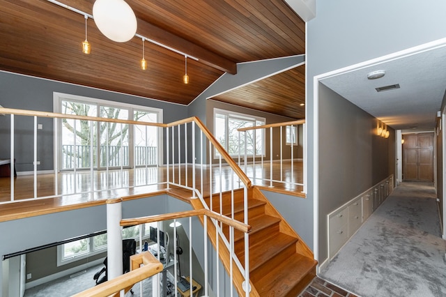 1509 Woodland Dr SW, Rochester, MN 55902 - stairs with vaulted ceiling with beams, baseboards, visible vents, and wood ceiling