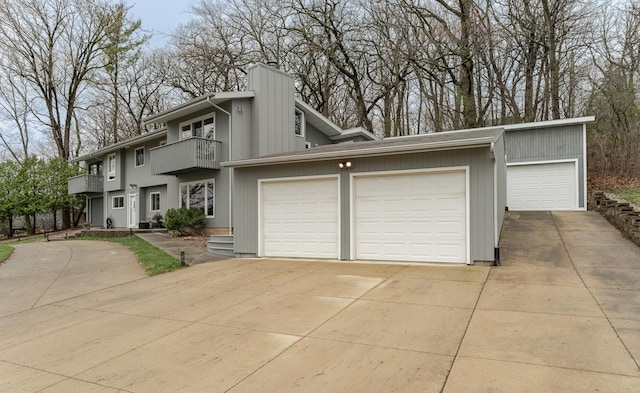 1509 Woodland Dr SW, Rochester, MN 55902 - view of front of home with a balcony and a chimney